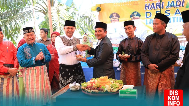 Hut Desa Langkitin ke 20, Wabup Indra Gunawan Resmikan Aplikasi Pintu Desa