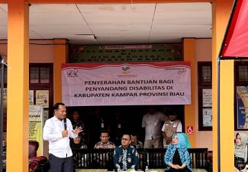 Pj Bupati Kampar Serahkan Bantuan Atensi Bagi Penyandang Disabilitas di Kabupaten Kampar